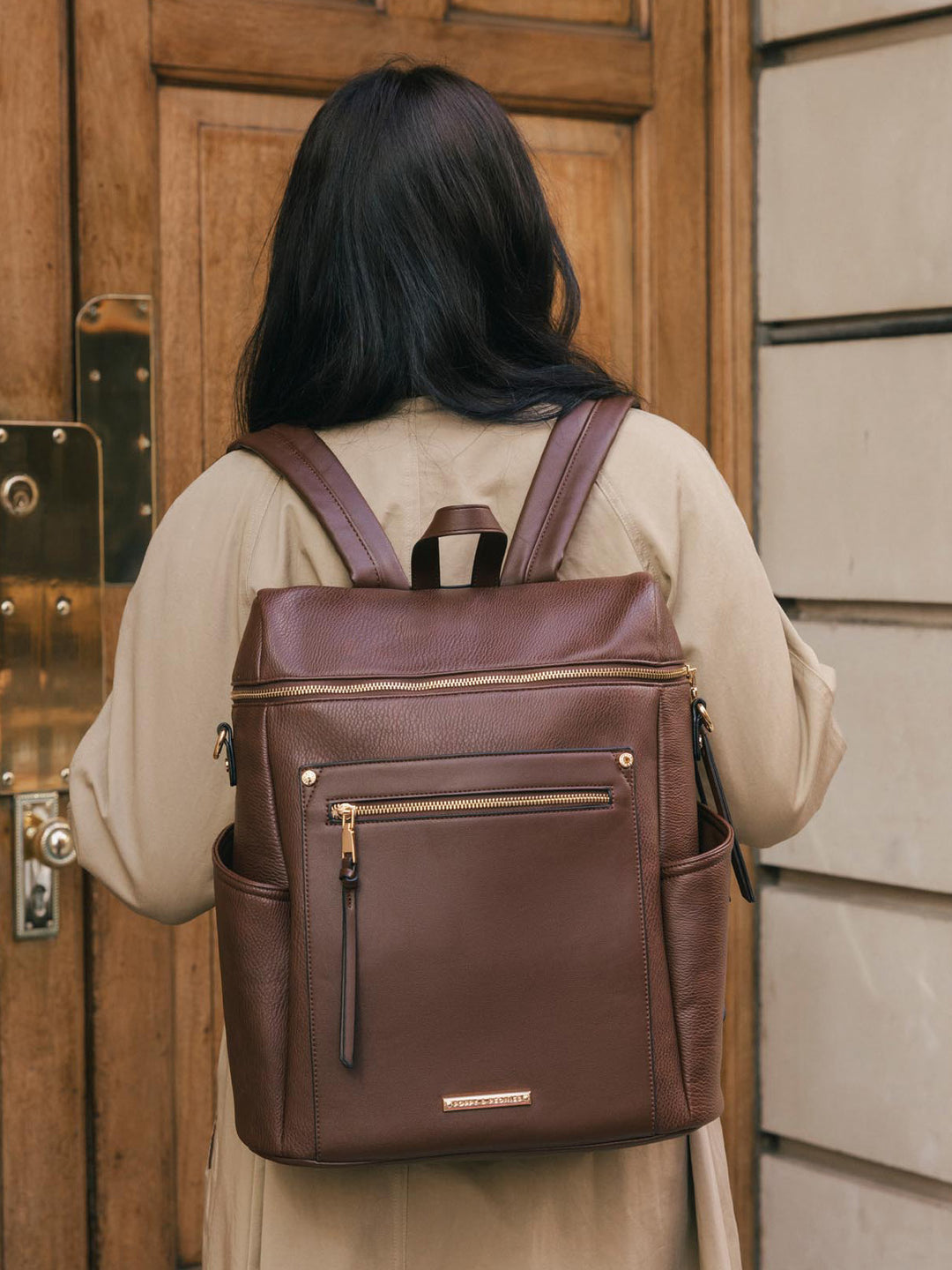 Close-up back view of the Poppy & Peonies Commuter Backpack in Espresso worn over both shoulders.