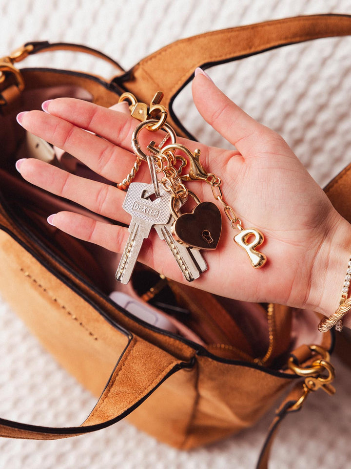 Close-up of Poppy & Peonies The Pick Me Up Tote in Cognac Suede showing the interior key leash with keys attached.