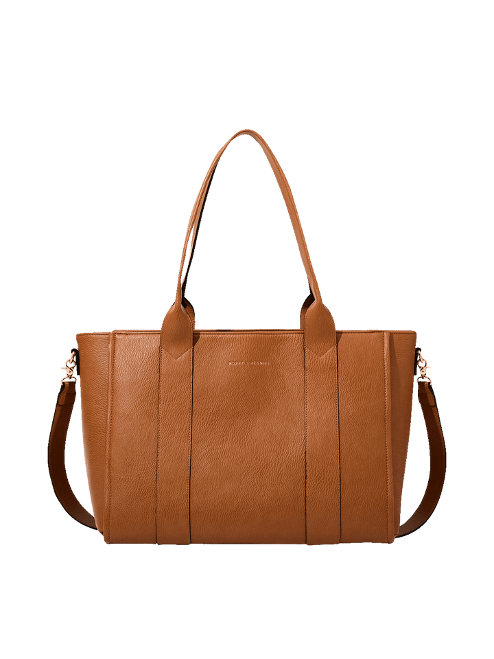 Poppy and Peonies Multitasker Cognac featuring a structured cognac brown tote with textured exterior, double top handles, detachable shoulder strap, gold-tone hardware, and subtle front