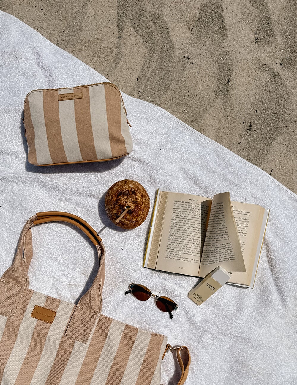 Poppy and Peonies of a cosmetic bag in camel stripe on the towel