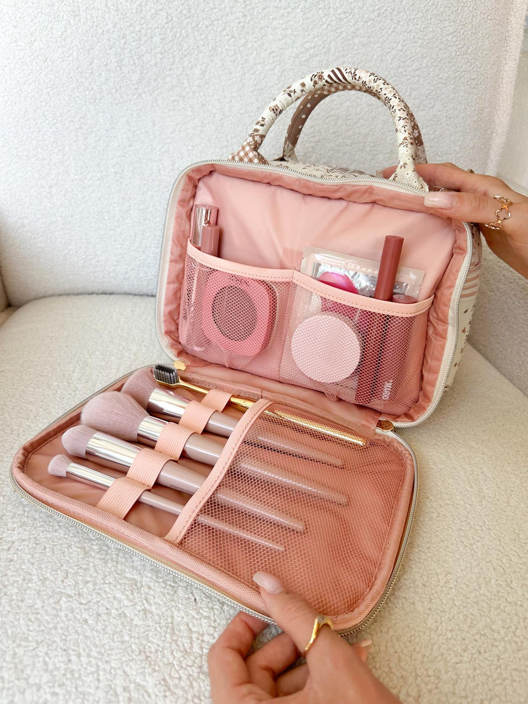 Poppy & Peonies The Routine Cosmetic Case in Brown Patchwork with makeup brushes and beauty essentials organized inside.