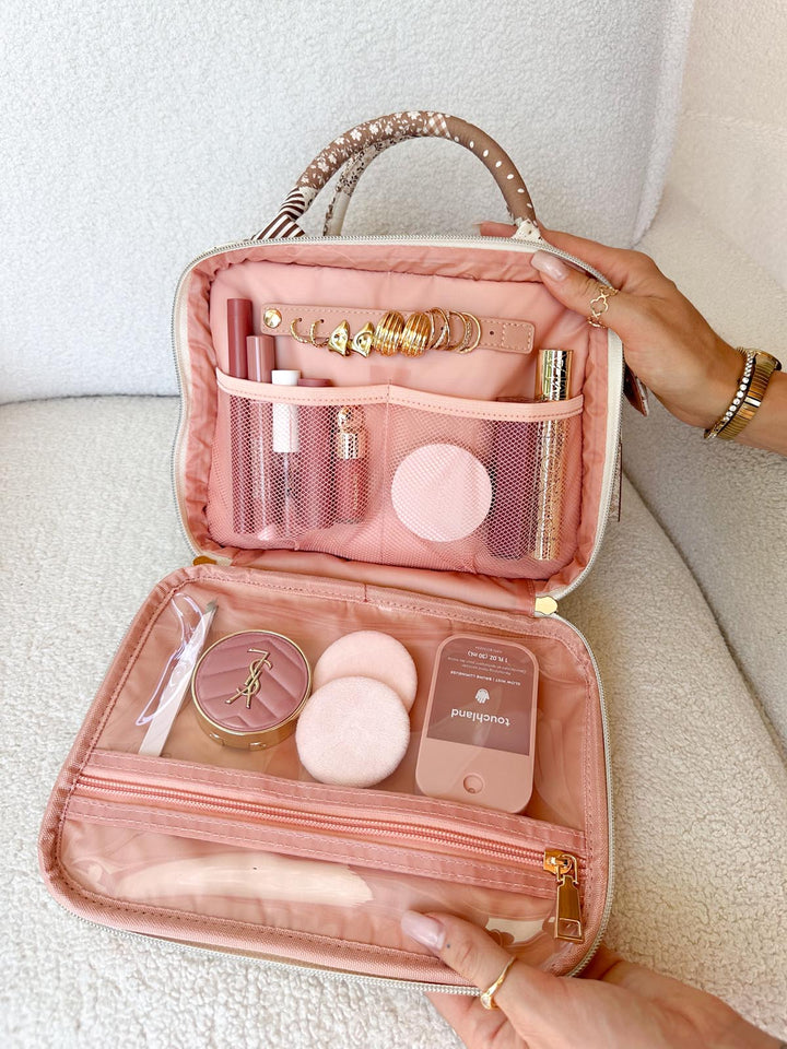 Poppy & Peonies The Routine Cosmetic Case in Brown Patchwork open with organized cosmetics and jewelry.