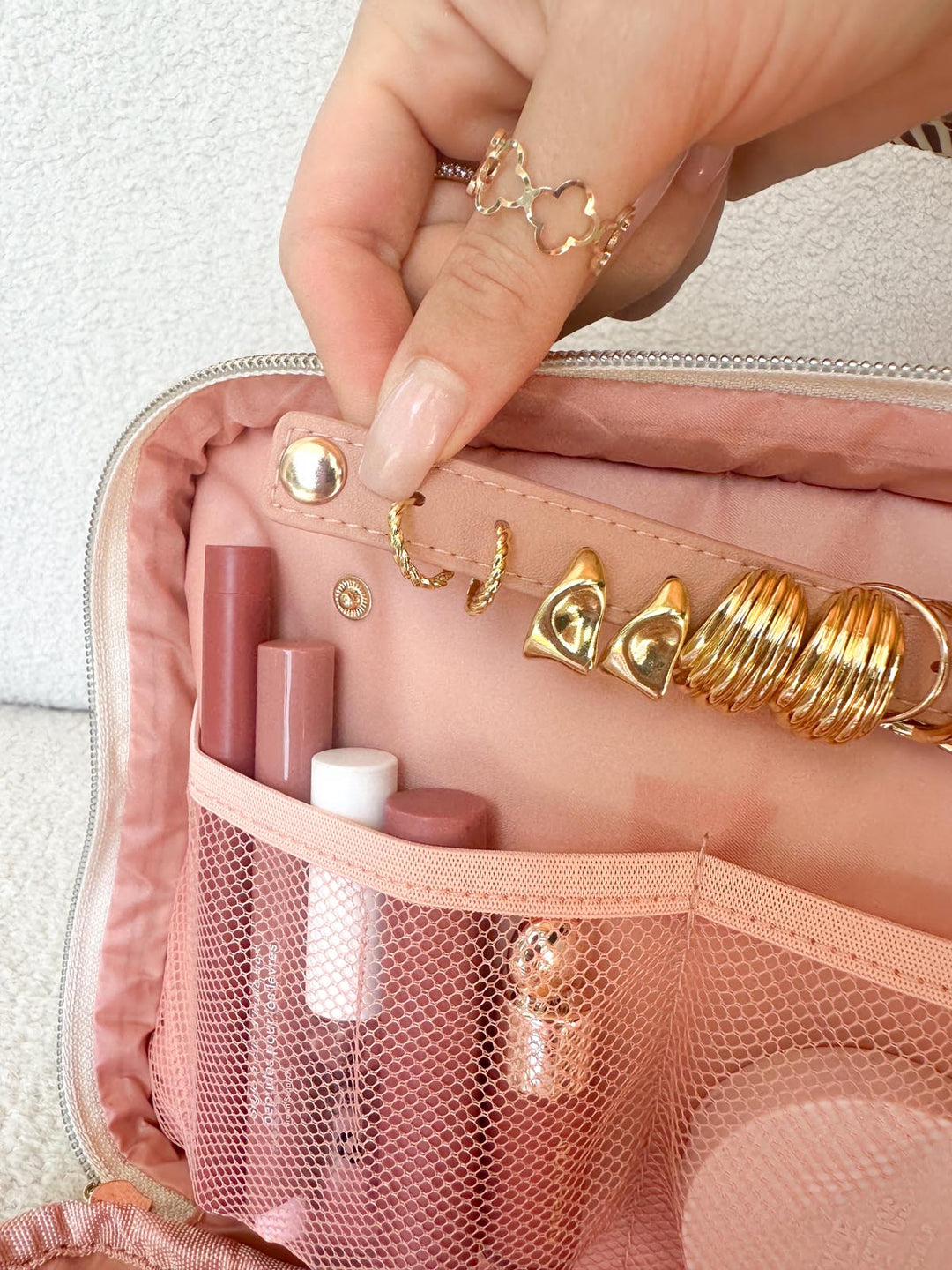 Poppy & Peonies The Routine Cosmetic Case in Brown Patchwork interior jewelry storage with earrings and rings.
