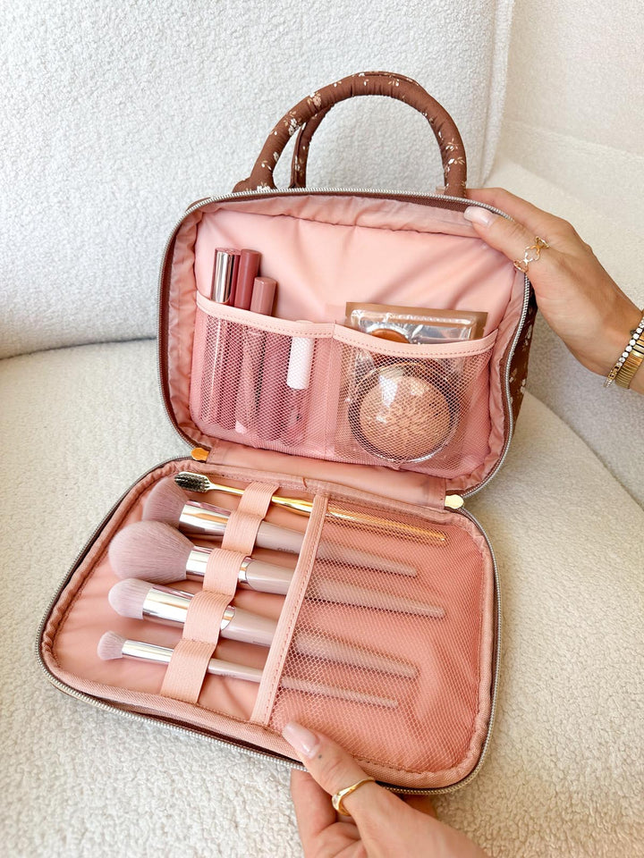 Poppy & Peonies The Routine Cosmetic Case in Brown Floral with makeup brushes and beauty essentials organized inside.