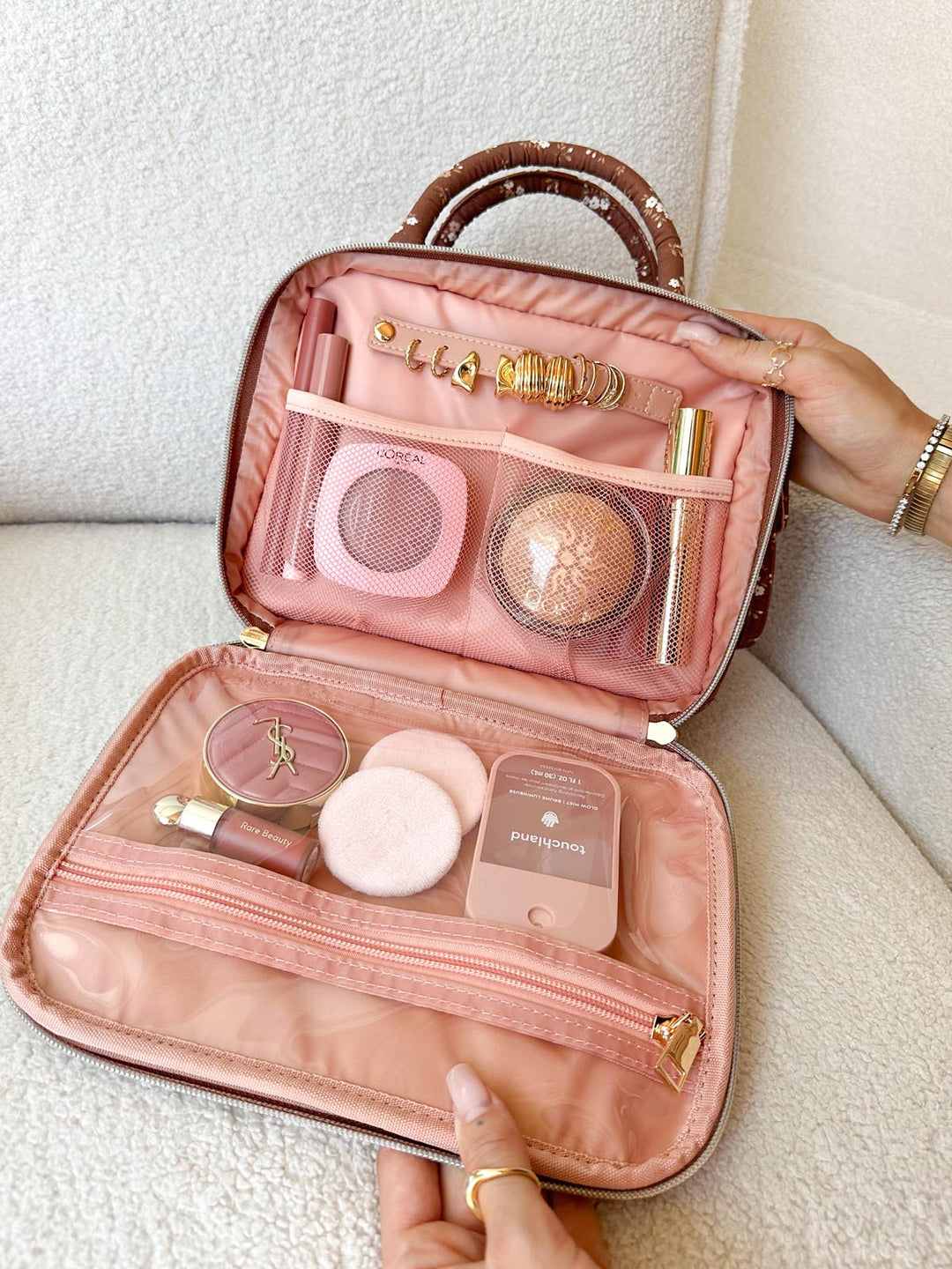 Poppy & Peonies The Routine Cosmetic Case in Brown Floral open with organized cosmetics and jewelry.
