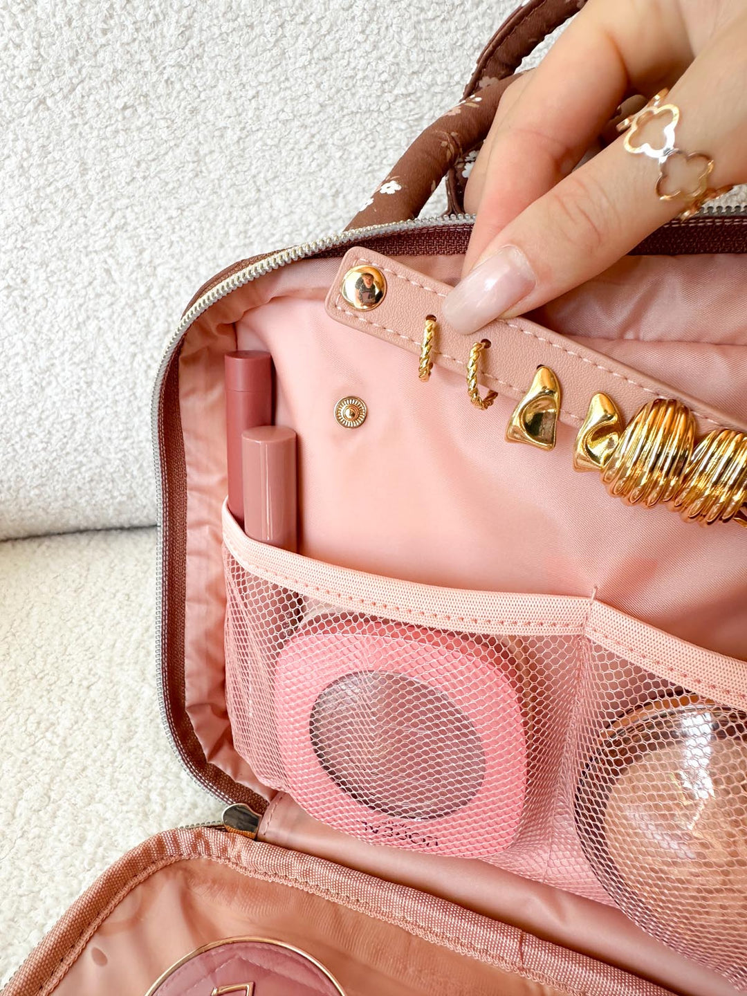 Poppy & Peonies The Routine Cosmetic Case in Brown Floral interior jewelry storage with earrings and rings.