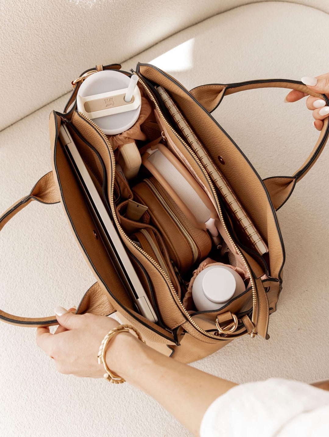 Open mocha mousse handbag on a light background