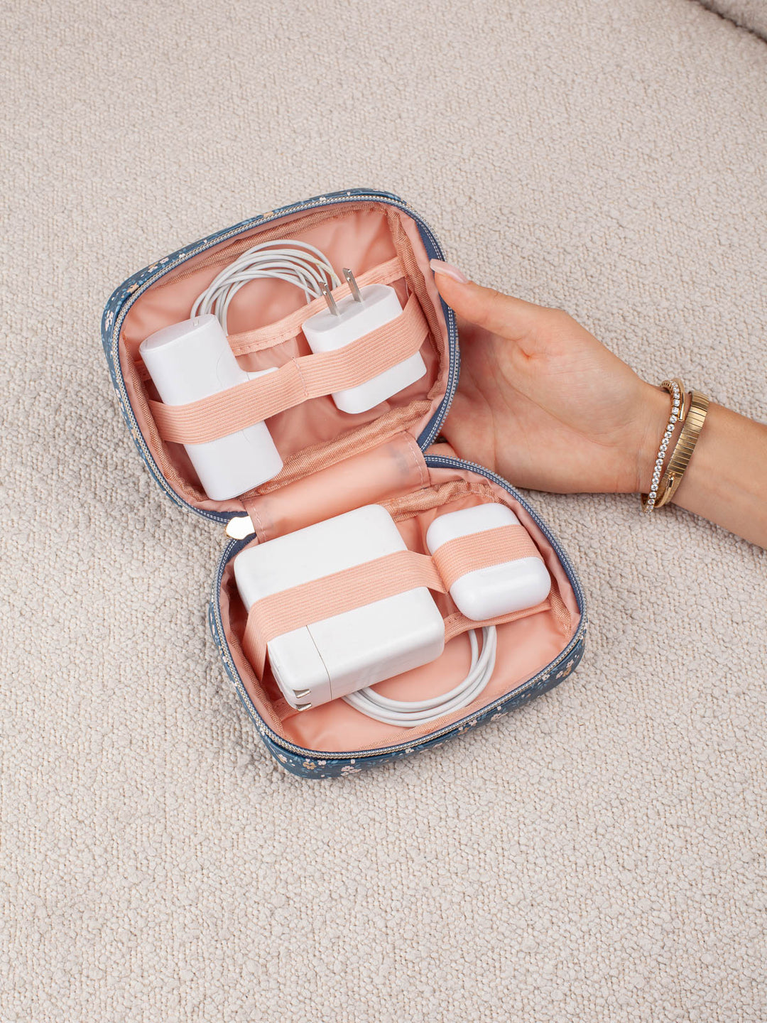 Poppy & Peonies Getaway Cosmetic Set in Navy Patchwork organizer with tech accessories secured inside.