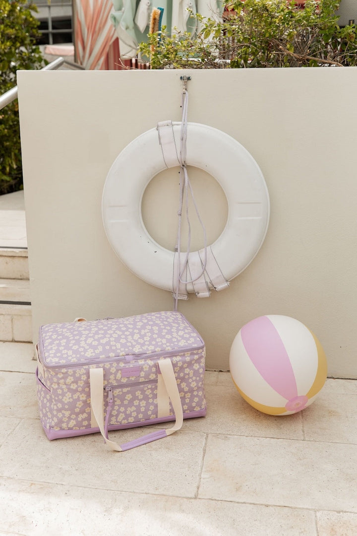 A violet floral Poppy and Peonies cooler bag