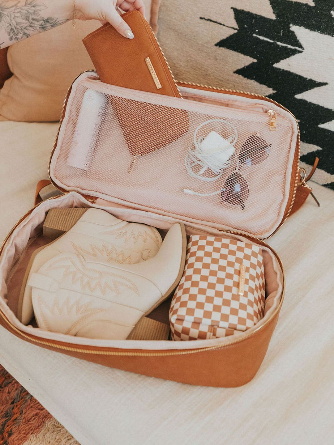 Open compartment on a brown vegan leather travel bag