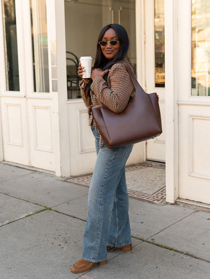 Poppy & Peonies The Companion Tote in Espresso full-length lifestyle view, highlighting its everyday size and shoulder carry.