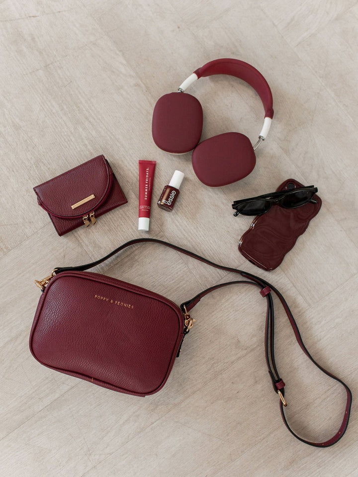 Berry coloured vegan leather bag with matching wallet and accessories