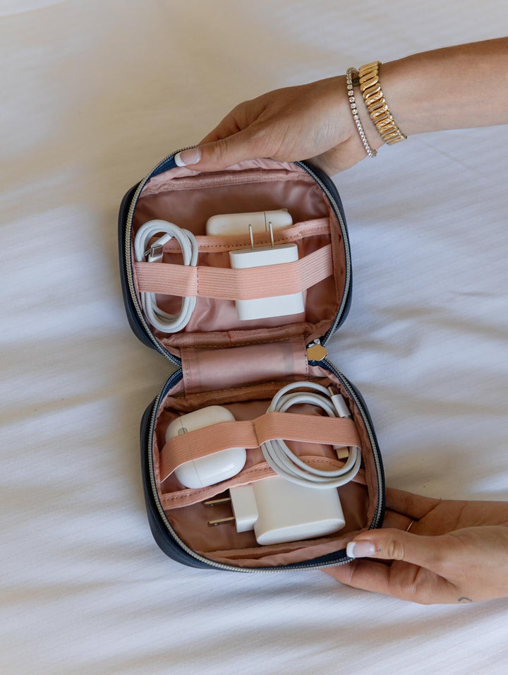 Tech case containing organized cords and chargers