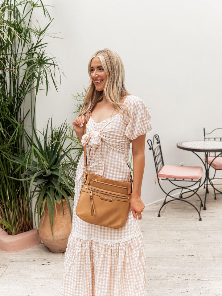 the EVERYDAY CROSSBODY camel