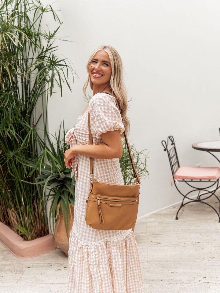 the EVERYDAY CROSSBODY camel