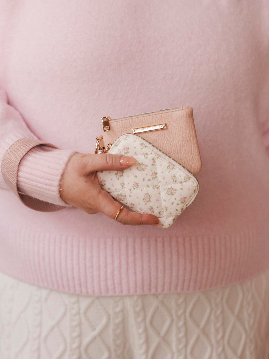 Woman holding two card holders
