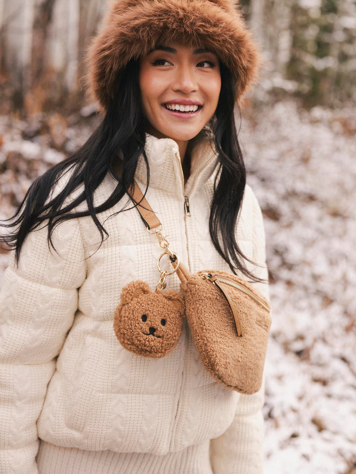 teddy bear bag charm on a faux fur crossbody bag