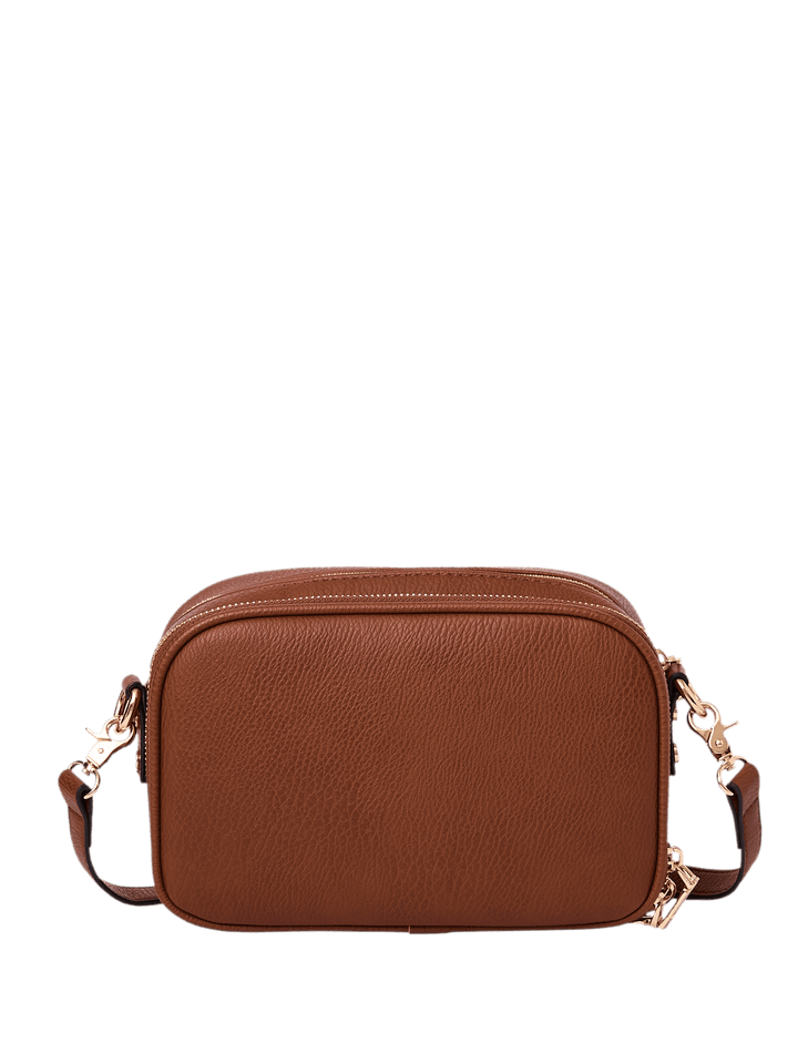 Brown vegan leather crossbody bag on a transparent background