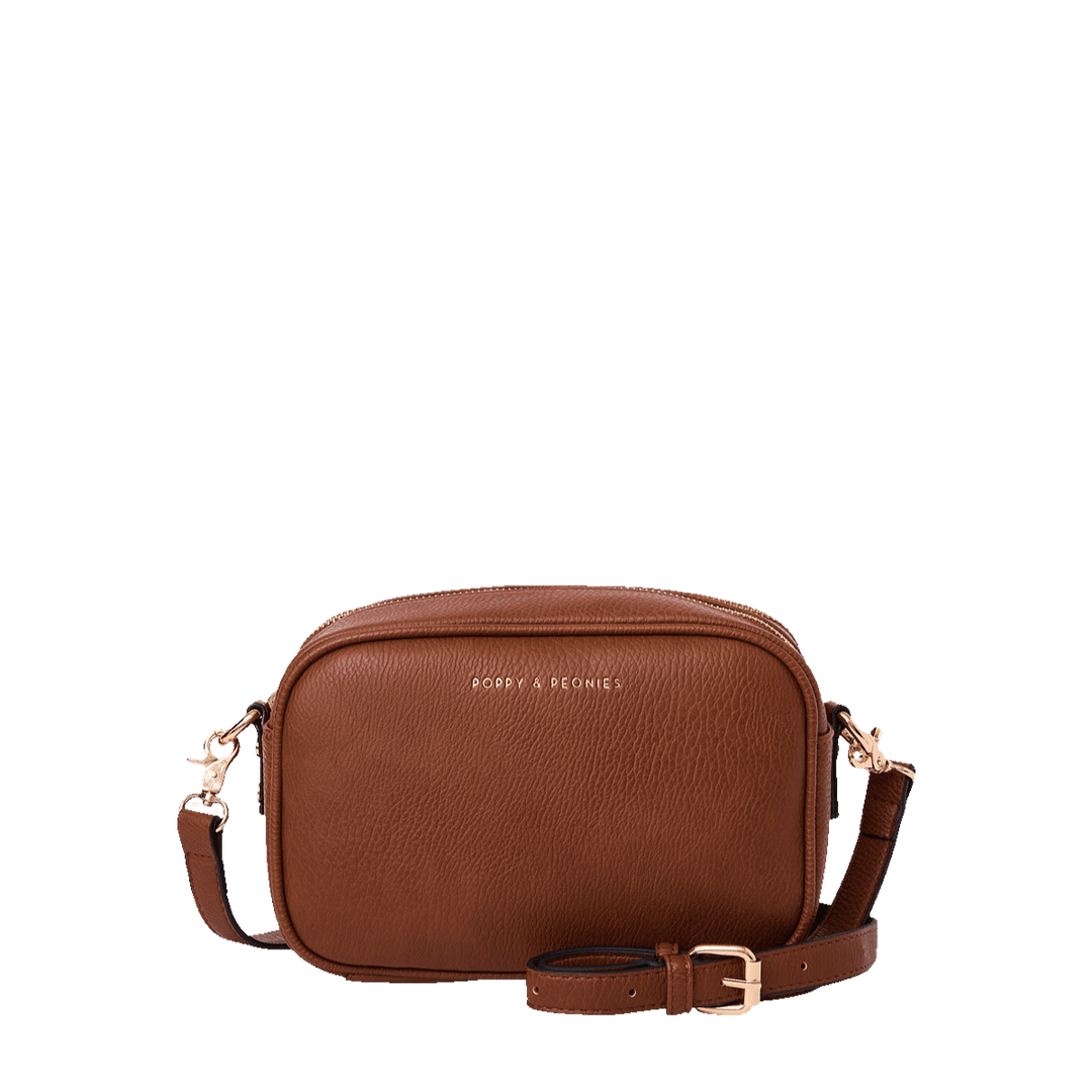 Brown vegan leather crossbody bag on a transparent background