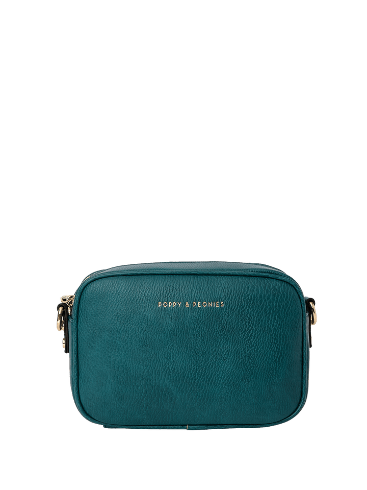 Teal crossbody bag with 'Poppy and Peonies' branding on a transparent background