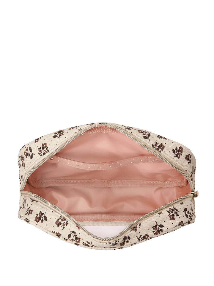 Floral-patterned makeup bag with pink interior