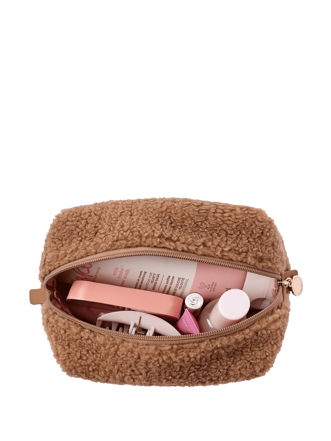 Brown textured cosmetic bag with toiletries on a transparent background