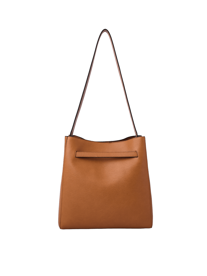 Poppy & Peonies The Knot Shoulder Bag in Cognac, featuring a warm cognac brown pebbled exterior, long shoulder strap, and a horizontal seam detail near the top.