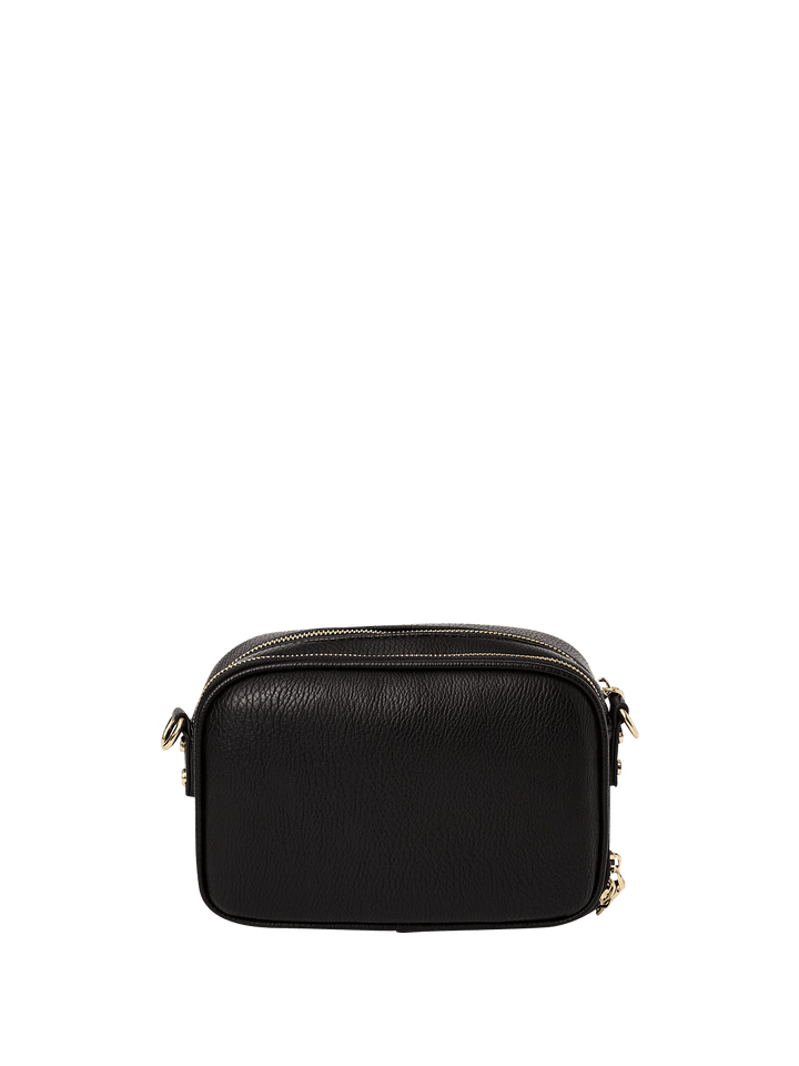 Back of a black vegan leather crossbody bag on a transparent background