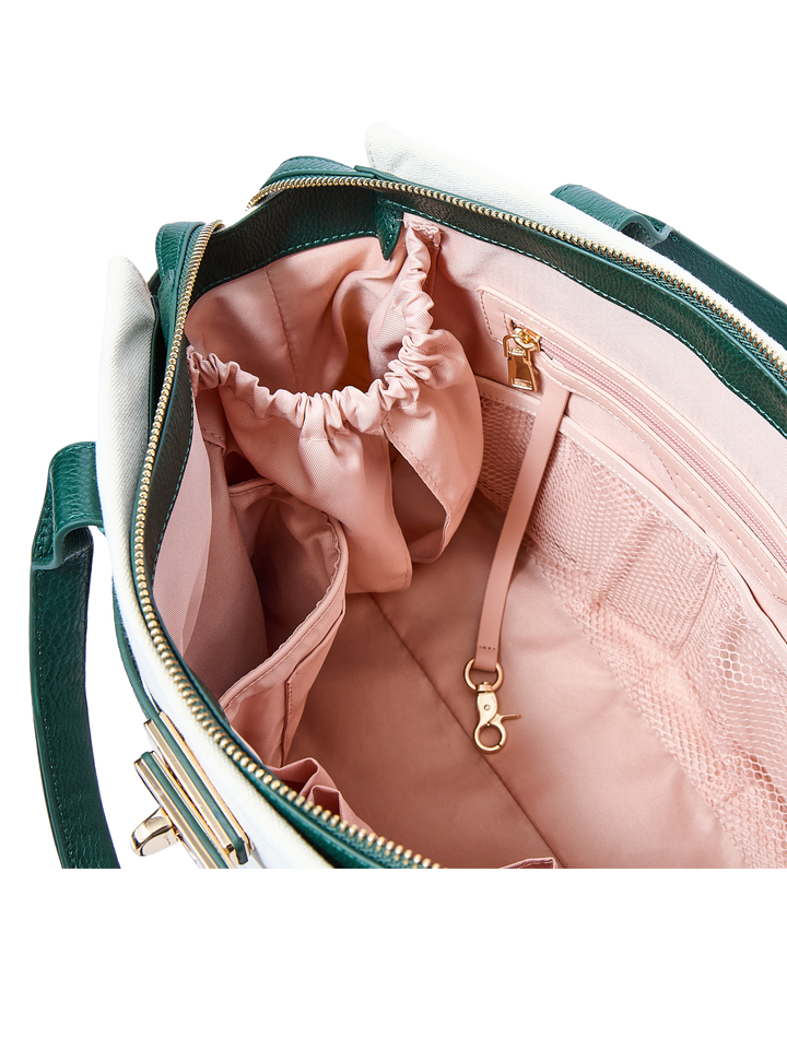 Interior of a handbag with a built in Stanley cup holder 