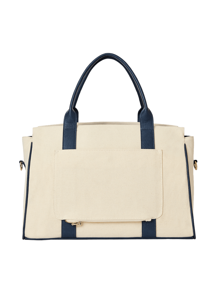 Natural canvas and navy handbag with gold hardware