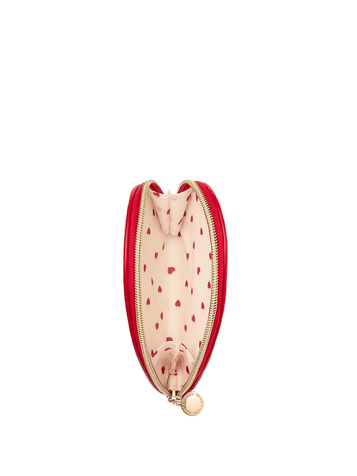 Open red pouch with gold zipper and red heart pattern interior 
