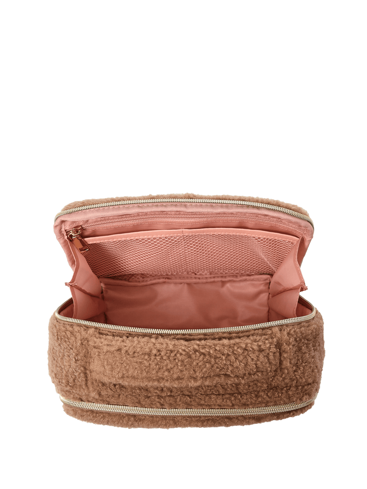 Interior of a brown faux fur cosmetic bag