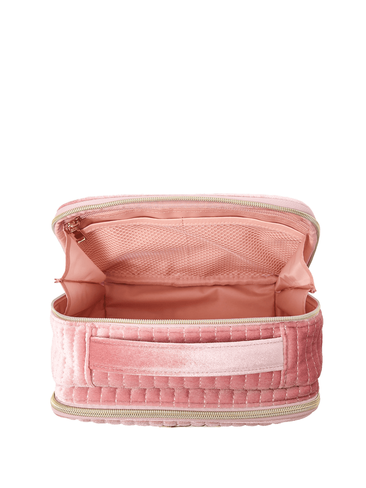 Pink velvet quilted cosmetic bag with a handle