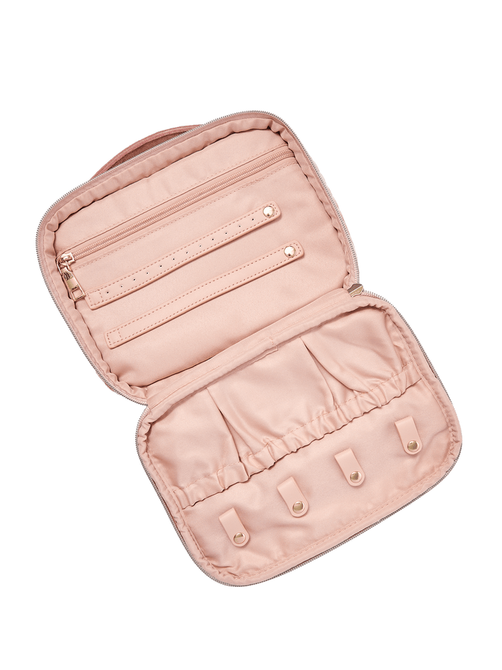 Pink velvet quilted cosmetic bag with jewelry tabs and pockets