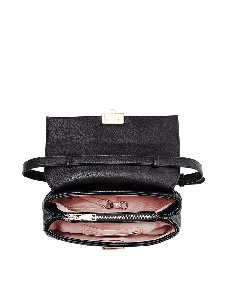 Poppy and Peonies Midnight Convertible Clutch displayed fully open from above, revealing its blush pink interior with multiple storage compartments, organized essentials, and gold-tone hardware.