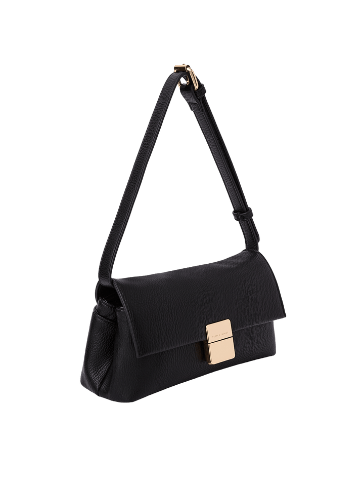 Poppy and Peonies Midnight Convertible Clutch displayed at a three-quarter angle, showcasing its textured black exterior, slim structured profile, adjustable shoulder strap, and gold-tone rectangular clasp.