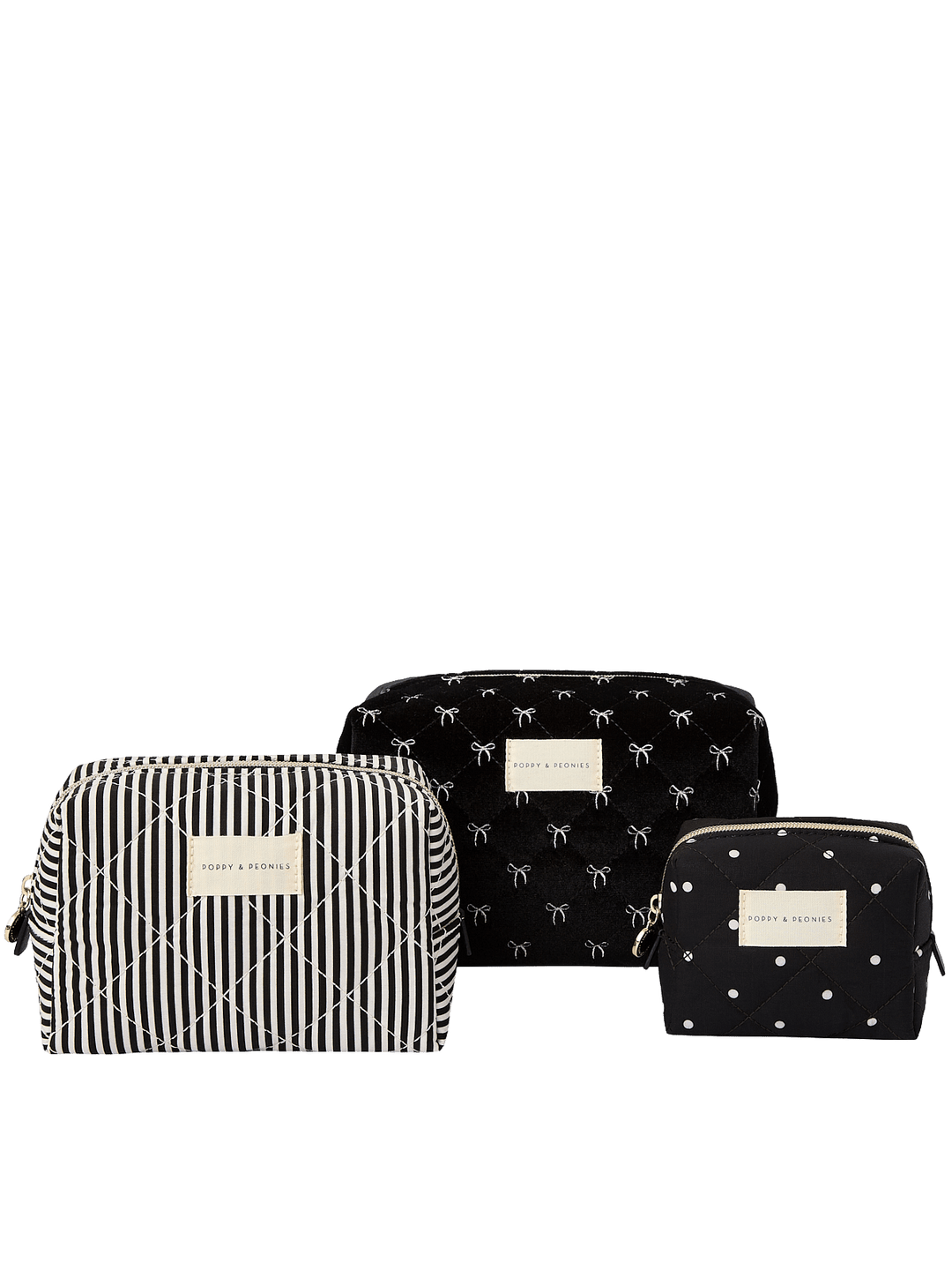 Poppy and Peonies Cosmetic Trio Black Velvet featuring three coordinating cosmetic pouches in different sizes, including a large black velvet pouch with delicate white bow patterns, a medium black and white striped pouch, and a small black velvet pouch with white bow patterns, accented with gold-tone hardware and logo plates.