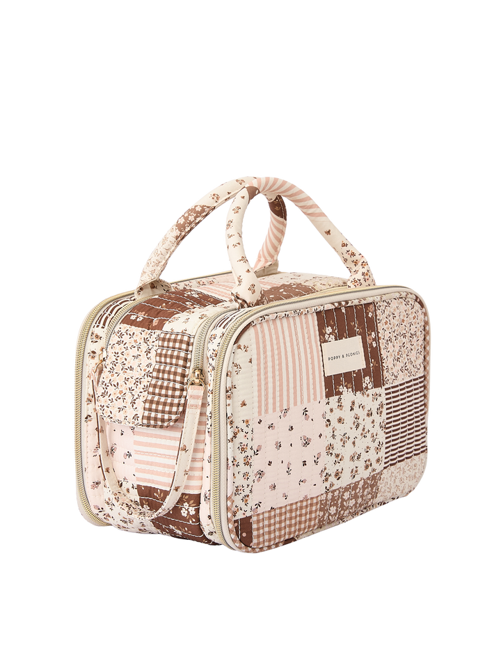 Poppy & Peonies The Routine Cosmetic Case in Brown Patchwork angled side view.
