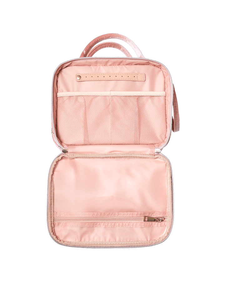 Poppy and Peonies The Routine Cosmetic Pink Velvet displayed fully open from above, highlighting its blush pink lining, interior zippered pocket, elastic storage sections, and organized compartments for beauty essentials.