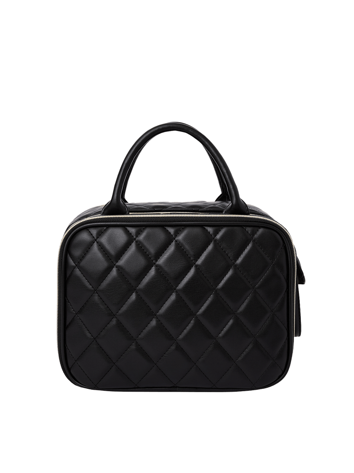 Poppy and Peonies The Routine Cosmetic Black displayed from the back, featuring its black diamond-quilted exterior, structured rounded silhouette, dual black top handles, and zippered closure.