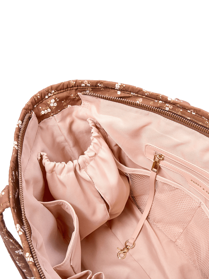 Close-up of the Daydreamer Tote in Brown Floral showing interior cup holders and organization pockets