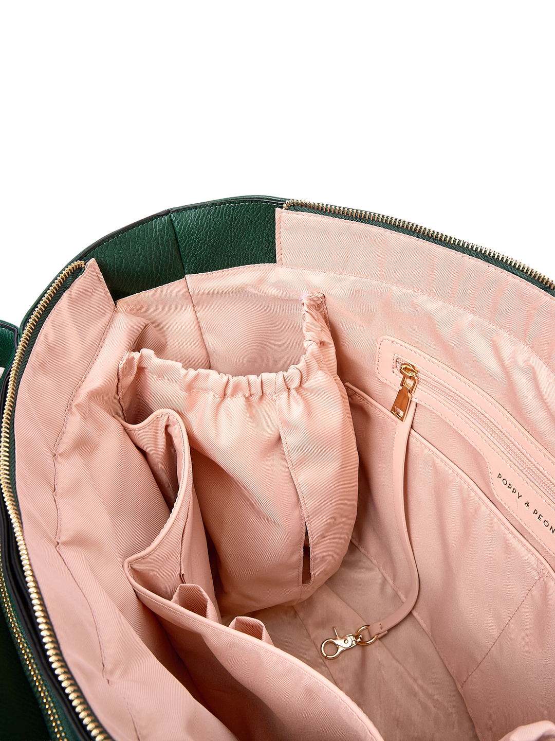 Close-up of the Double Duty Tote in Heritage Green showing interior organization pockets and key leash