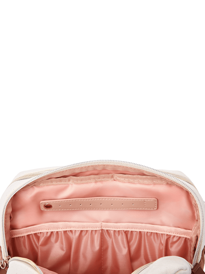 Poppy & Peonies The Double Take Cosmetic in Chestnut, interior view highlighting the blush-pink lining, zippered pocket, and gathered elastic storage compartments.