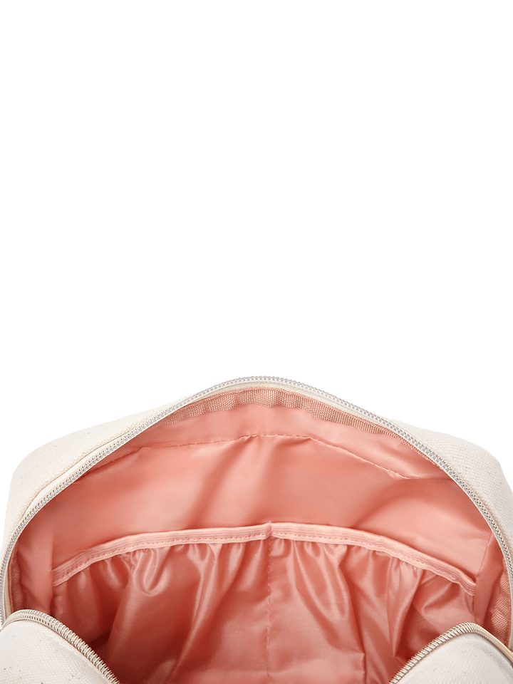 Poppy & Peonies The Double Take Cosmetic in Chestnut, close-up of the open blush-pink interior featuring gathered elastic organizer pockets for beauty essentials.