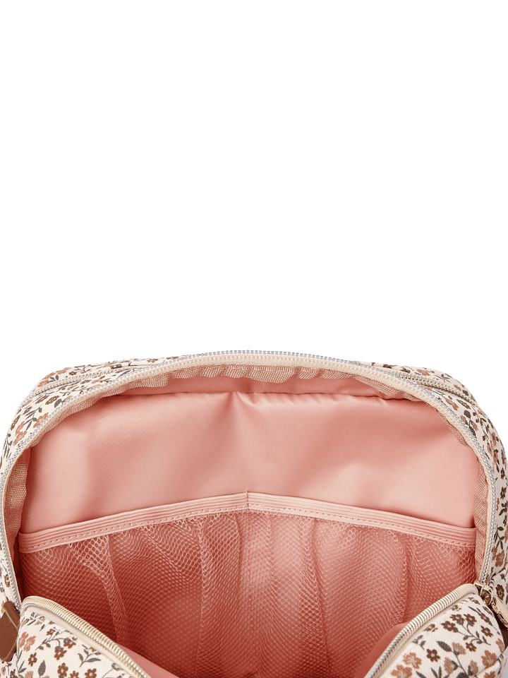 Poppy & Peonies Double Take Cosmetic Case in October Floral opened to reveal blush pink lining with interior mesh pockets for organizing beauty essentials.