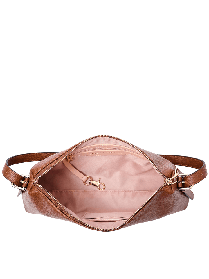 Poppy & Peonies The Soho Shoulder Bag in Chestnut, shown open from above with blush pink lining, interior organizer pockets, a key leash, and gold-tone hardware.