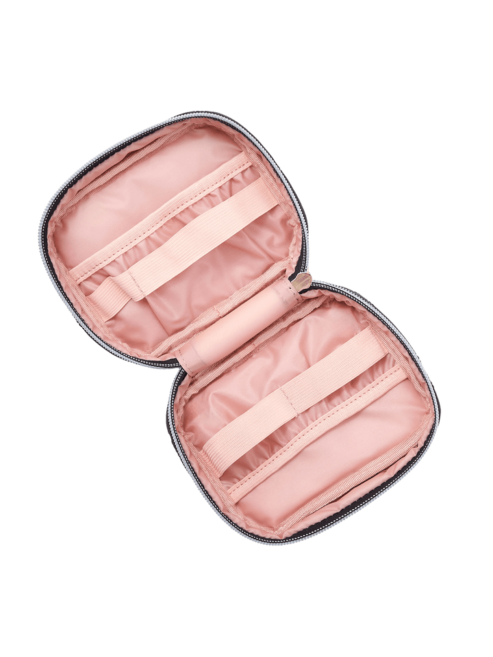 Poppy and Peonies Getaway Cosmetic Set Black Velvet displayed fully open at an angle, showcasing its blush pink interior, elastic organizers, zippered storage sections, and compartments for cosmetics and travel essentials.