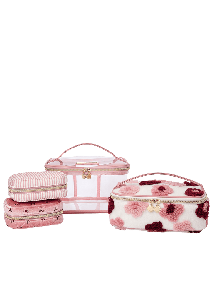 Poppy and Peonies Getaway Cosmetic Set Floral featuring three coordinating cosmetic cases displayed together, showcasing a large clear-front case with pink and berry floral patterns, a matching smaller floral pouch, and a blush pink organizer with gold-tone zipper hardware.