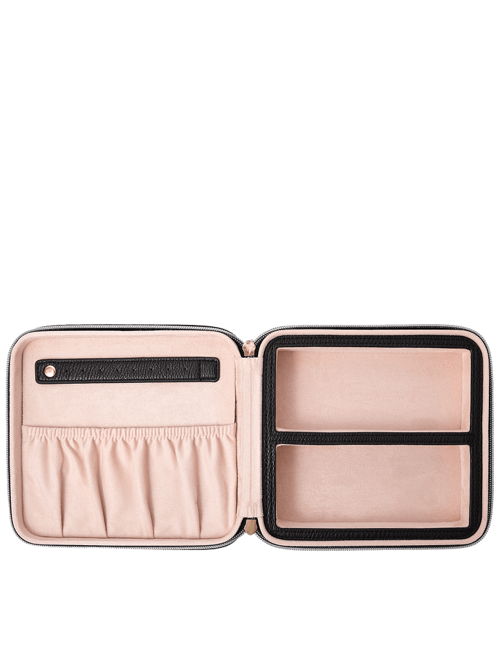 Poppy and Peonies The Out of Office Case Black displayed fully open, revealing its blush pink interior with an elastic storage pocket, two divided compartments, and organized sections for storing small essentials.