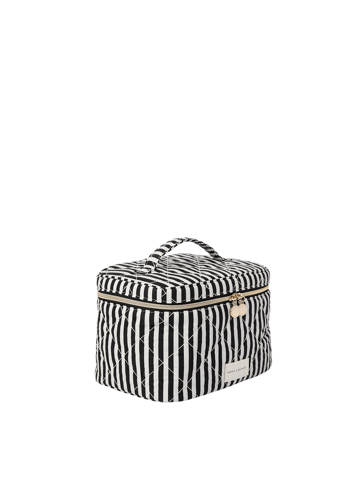 Poppy and Peonies Travel Trio Black Stripe featuring the large black and white striped travel case displayed at a three-quarter angle, highlighting its structured shape, striped exterior, top carrying handle, and spacious side profile.